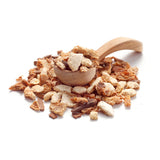 Close-up of Ankerkraut mulled wine spice mix with wooden spoon on white background