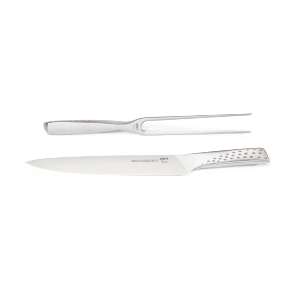 Edelstahl Tranchierbesteck-Set bestehend aus Messer und Gabel auf einfarbigem Hintergrund