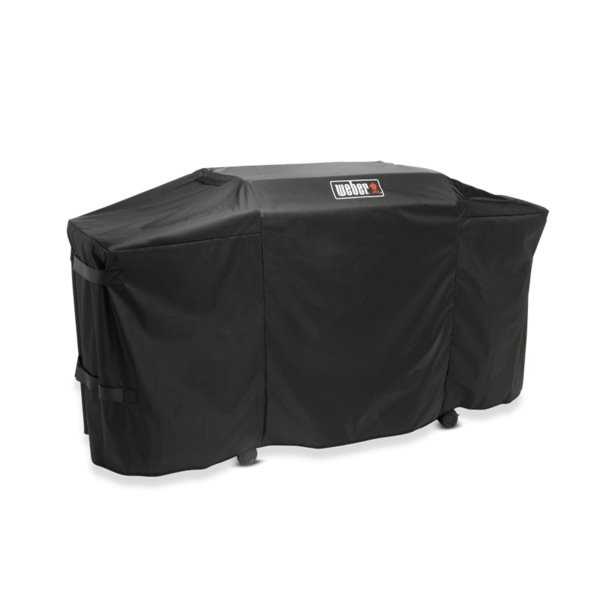 Weber Premium Abdeckhaube auf einer Plancha mit sichtbarem Logo und Klettbändern