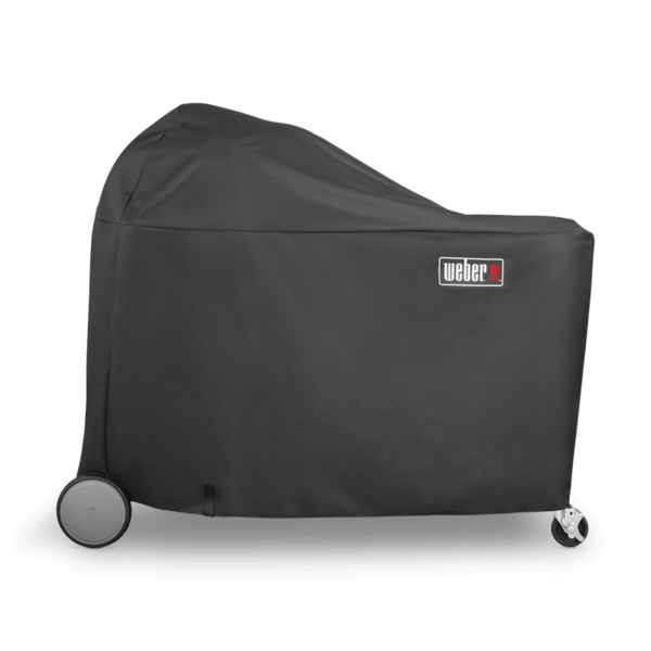 Schwarze Weber Premium Abdeckhaube über einem Summit Charcoal Grill-Center