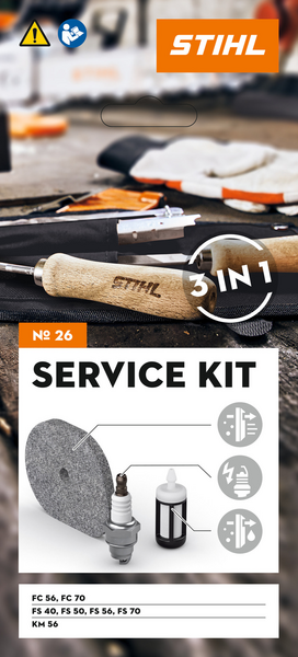 Werbung für STIHL Service Kit 26 mit Werkzeugen und Ersatzteilen auf Werkbank