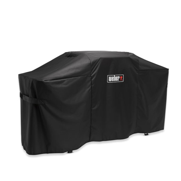 Schwarze Weber Premium Abdeckhaube über einer Plancha mit klappbarem Tisch