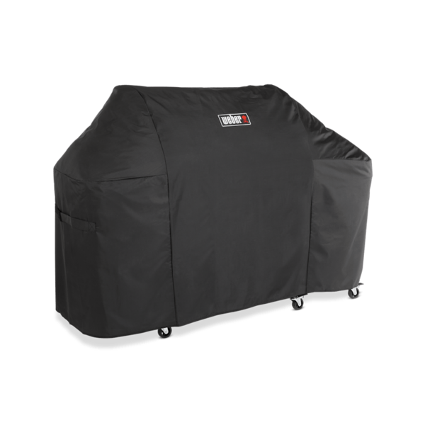 Weber Premium Abdeckhaube Summit FS38 über einem großen Grill