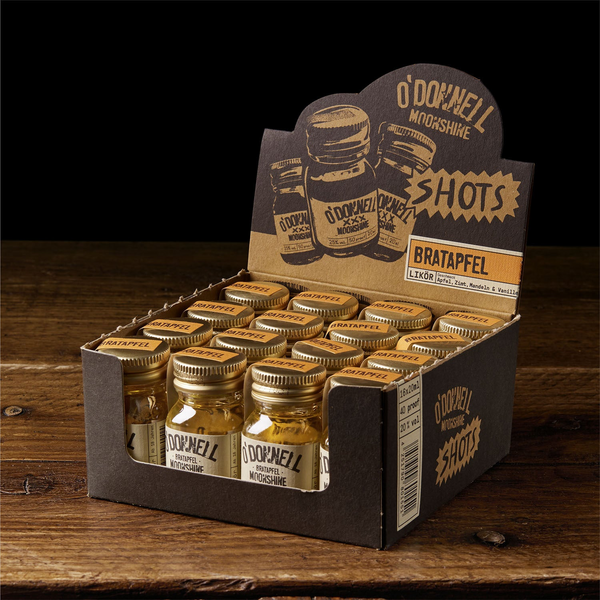 O'Donnell Moonshine Shots Bratapfel in einer stilvollen Verpackung auf Holztisch
