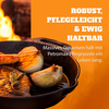 Gusseiserne Petromax Feuerpfanne mit Steak und Zwiebeln über offenem Feuer