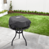 Weber Prem. Abdeckhaube auf Plancha in einem Garten