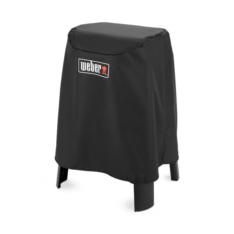 Schwarze Weber Premium Abdeckhaube über einem Lumin Elektrogrill mit Stand