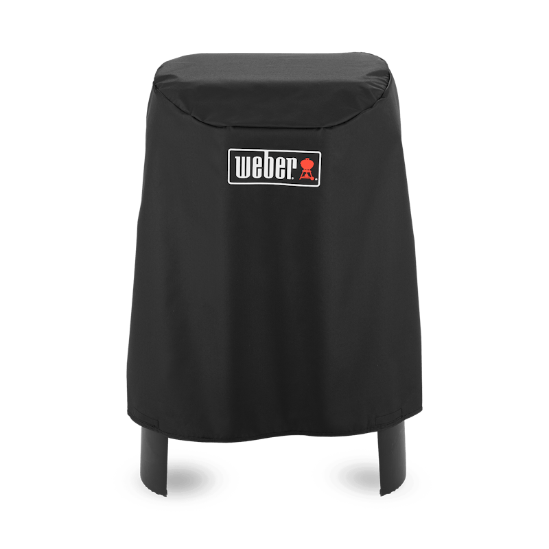 Schwarze Weber Premium Abdeckhaube über einem Lumin Elektrogrill