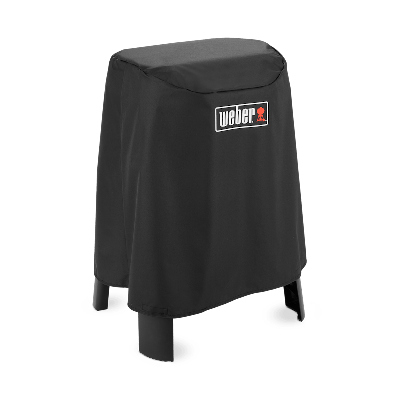 Schwarze Weber Premium Abdeckhaube über einem Lumin Elektrogrill mit Stand