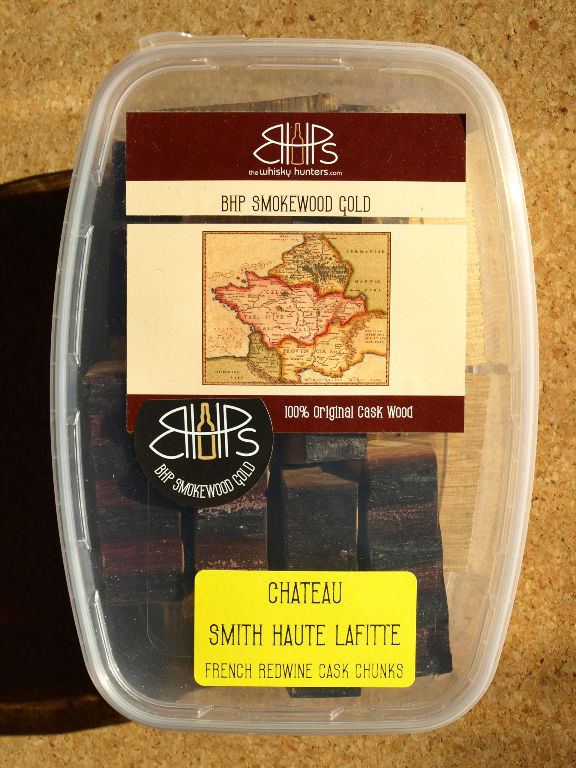 Transparente Box mit BHP Smokewood Gold Räucherchunks aus Rotweinfass-Holz