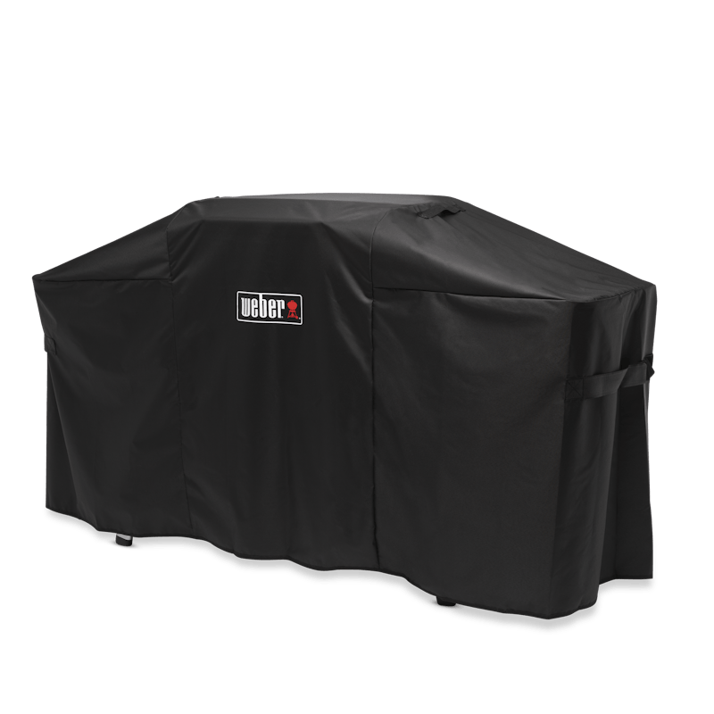 Schwarze Weber Premium-Abdeckhaube über einer Plancha mit Tisch