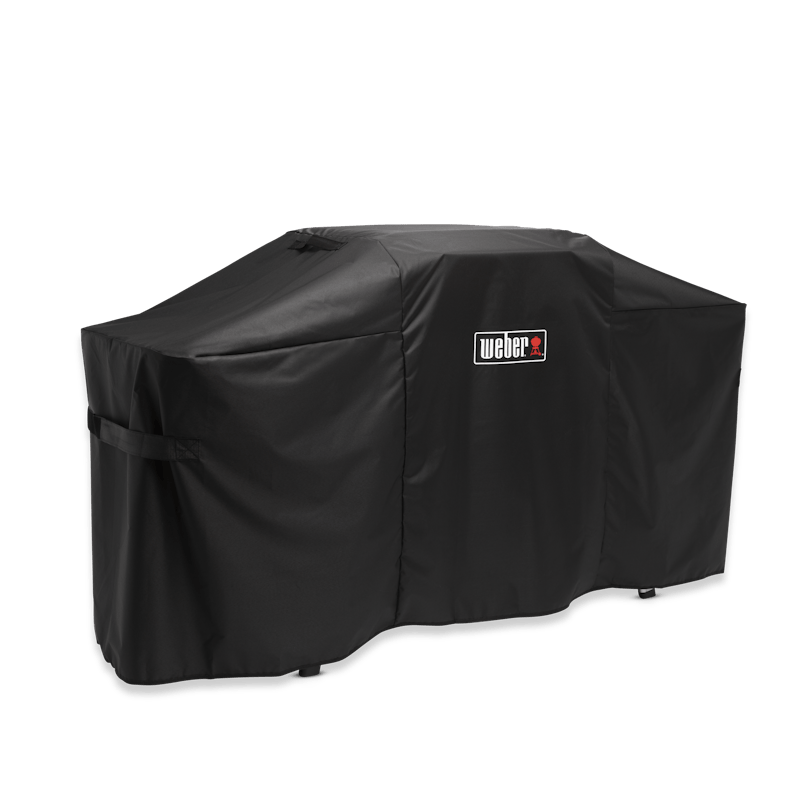 Schwarze Weber Premium Abdeckhaube über einer Plancha mit klappbarem Tisch