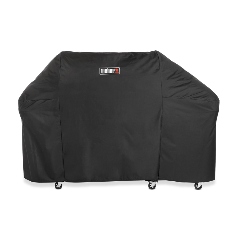 Schwarze Weber Premium Abdeckhaube Summit FS38 über einem großen Grill