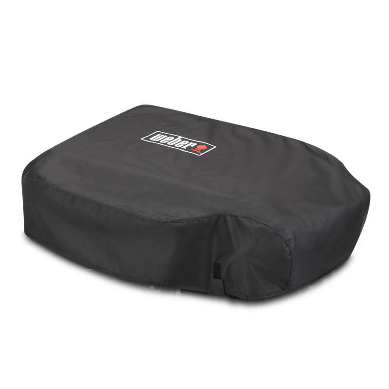 Weber Premium Abdeckhaube Slate 56cm auf einer Plancha mit Klettbändern und Logo
